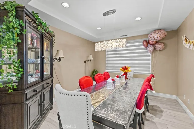 a living room with furniture and flowers