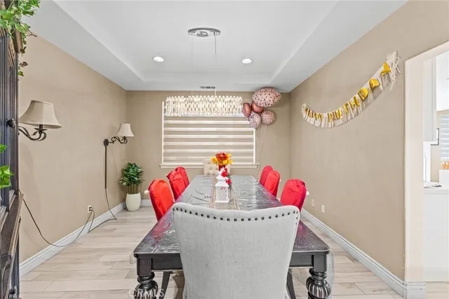 a living room filled with furniture and a floor to ceiling window