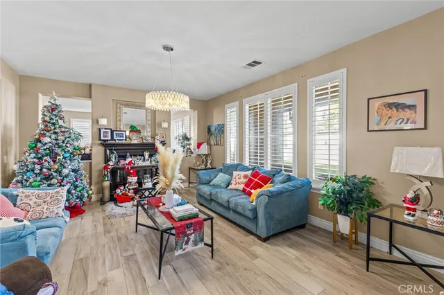 a kitchen with stainless steel appliances granite countertop a sink and a refrigerator