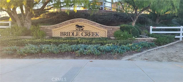 a front view of a house with plants