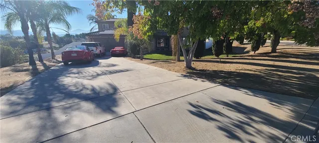 a living room with furniture and flowers