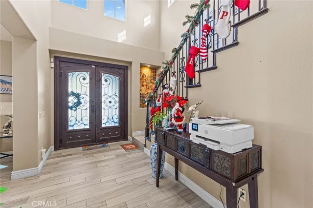 a living room filled with furniture and a potted plant