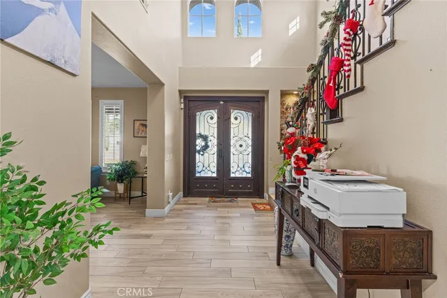 a view of entryway front of flowers