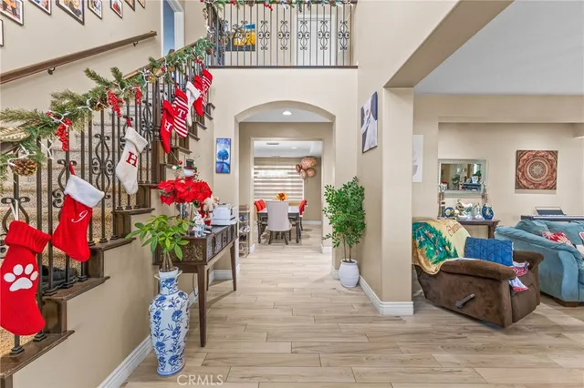 a view of a dining room with furniture and chandelier
