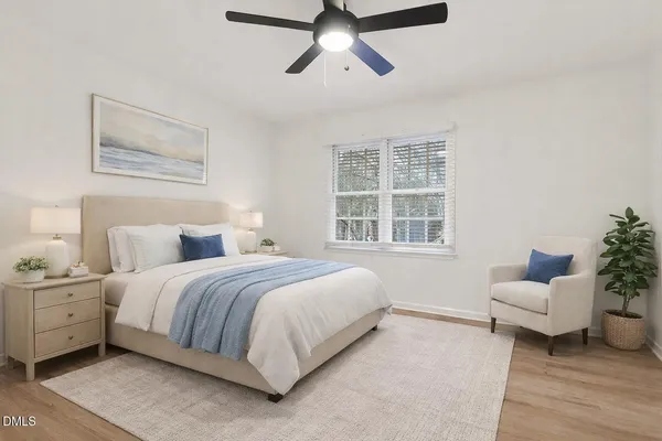 a bedroom with bed and window