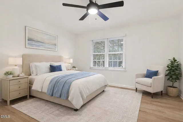 a bedroom with bed and window