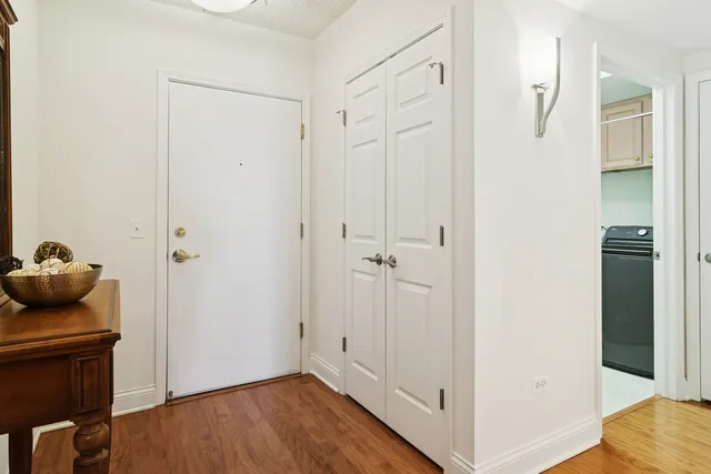 a kitchen with granite countertop a stove a refrigerator and a stove top oven