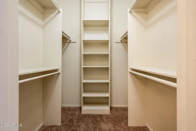 a view of an empty walk in closet