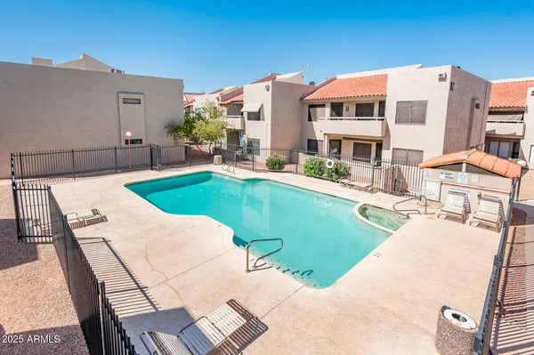 a view of a house with swimming pool