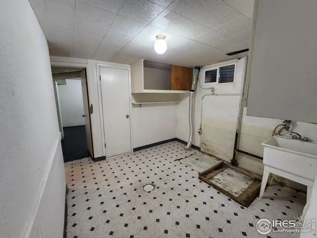 a room with a table and appliances