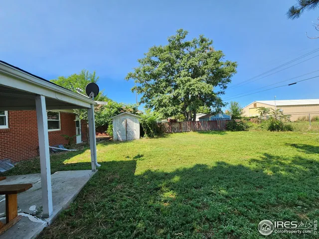 a view of a back yard of the house