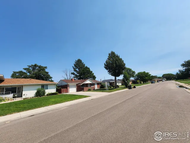 a view of a house with a street