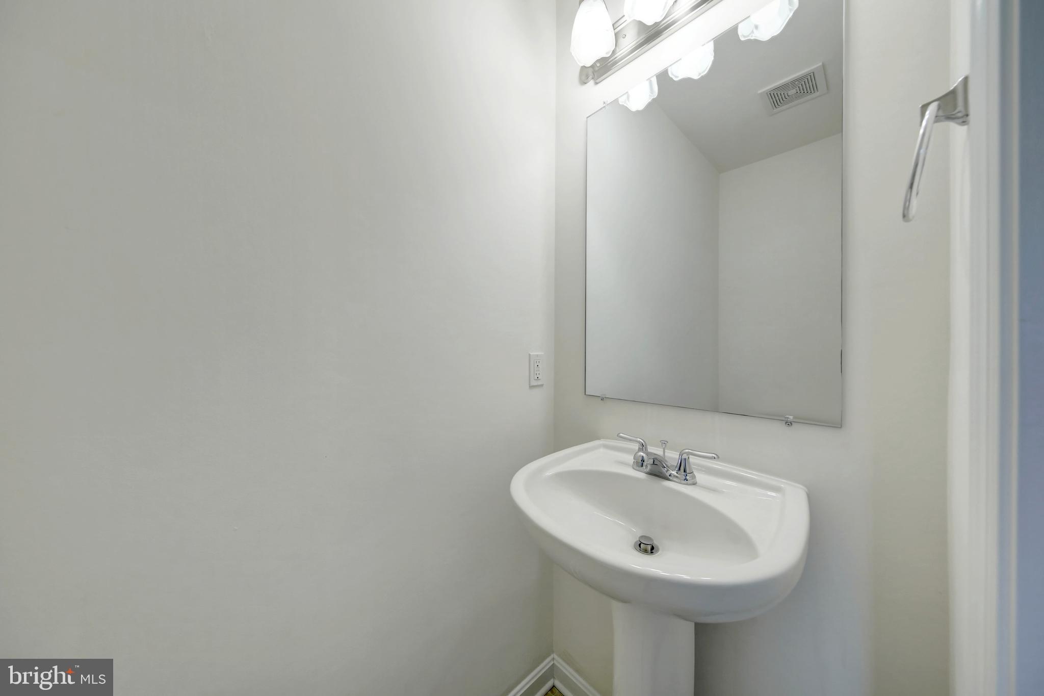 689 East Walnut Street Hanover, PA 17331 - Photo 11 of 31 a bathroom with a sink and a mirror