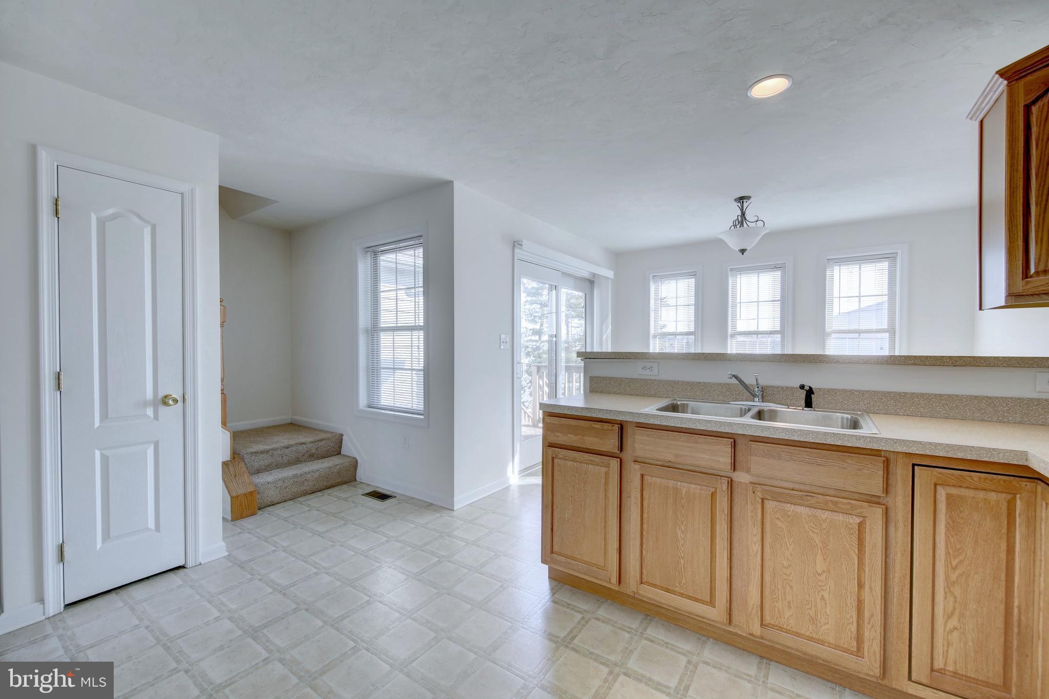 689 East Walnut Street Hanover, PA 17331 - Photo 16 of 31 a spacious bathroom with a granite countertop sink a mirror and a bathtub