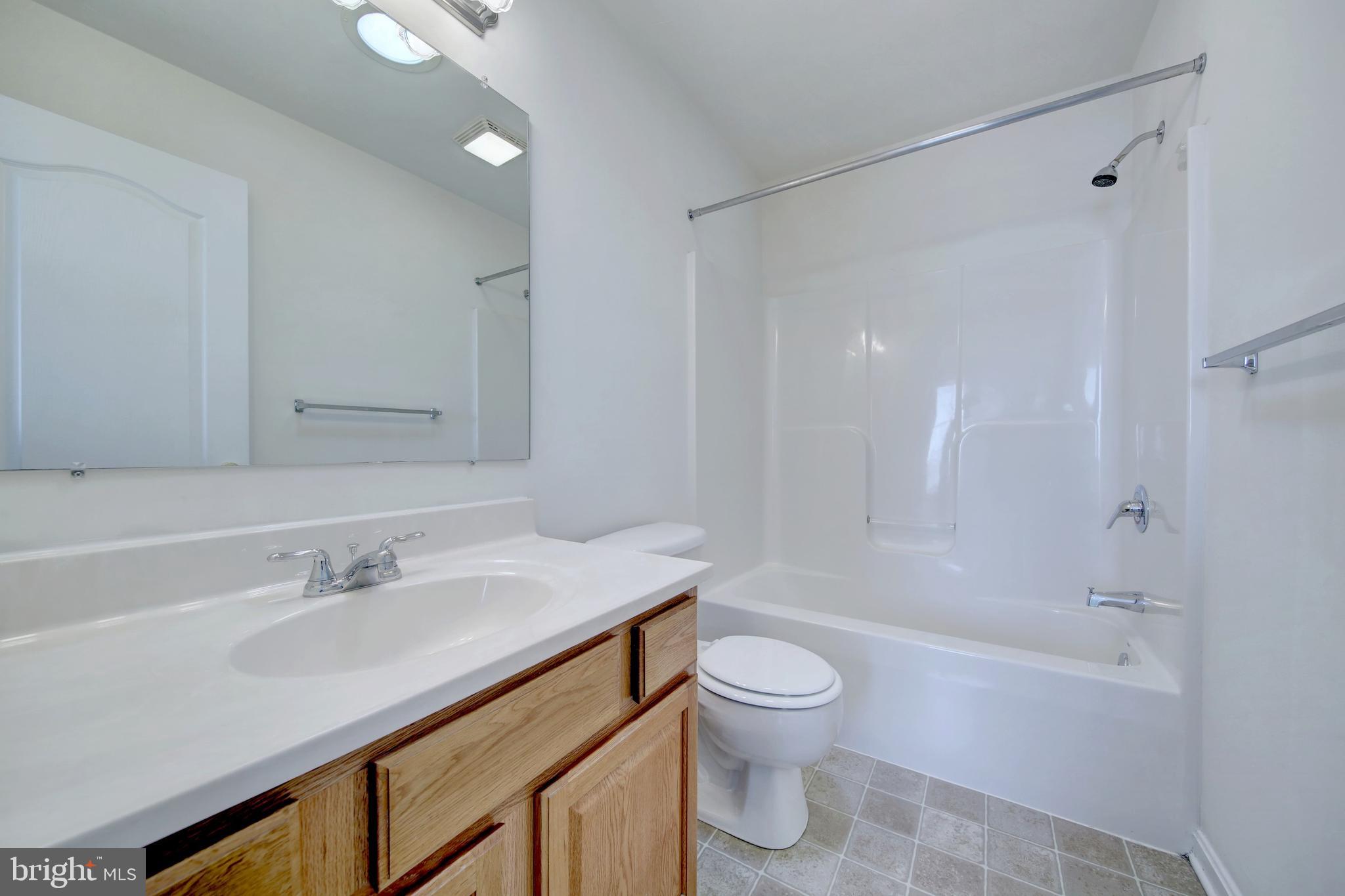 689 East Walnut Street Hanover, PA 17331 - Photo 25 of 31 a bathroom with a sink toilet and shower