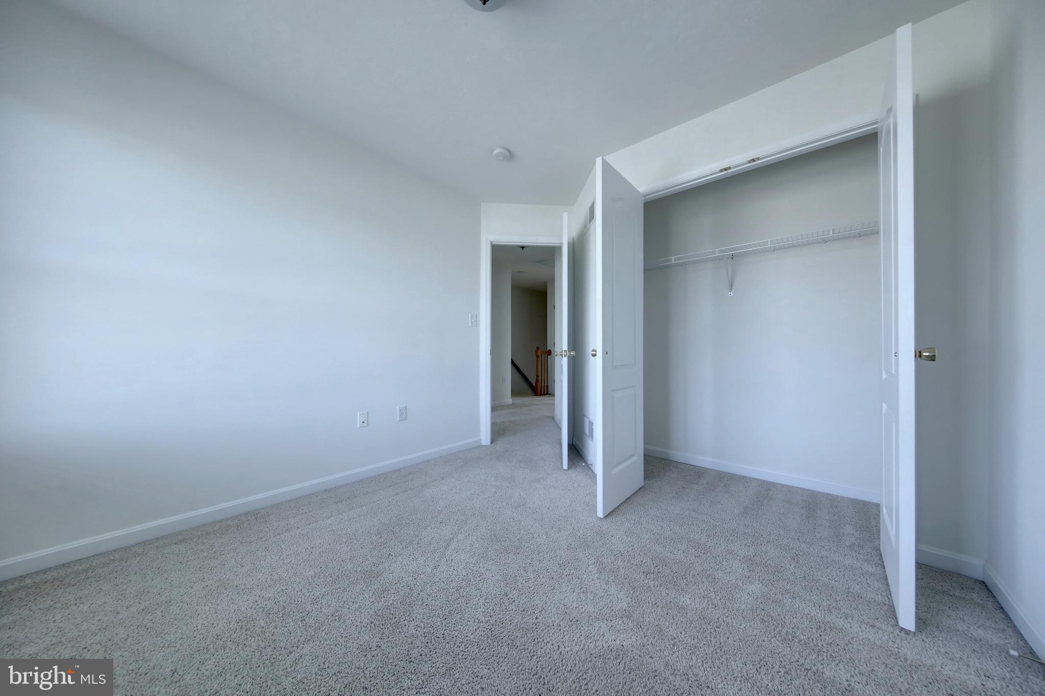 689 East Walnut Street Hanover, PA 17331 - Photo 27 of 31 a view of an empty room with closet and wooden door