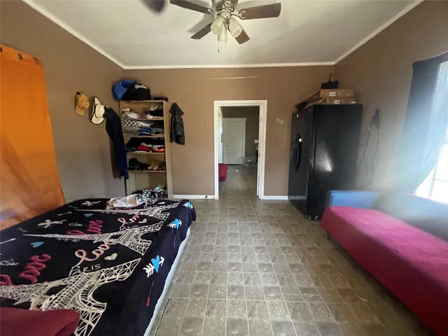 a bedroom with bed and a chandelier