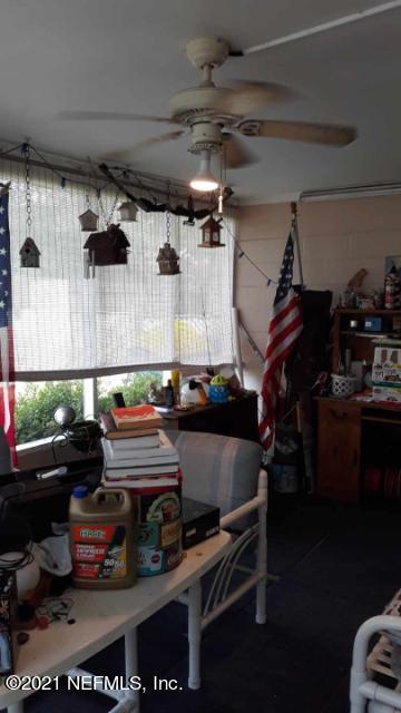 7016 Oakney Road Jacksonville, FL 32211 - Photo 12 of 16 a room with lots of different colored cloths