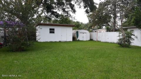 7016 Oakney Road Jacksonville, FL 32211 - Photo 5 of 16 a view of a tiny house with a yard
