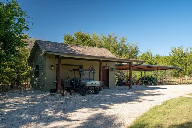 a kitchen that has a sink a stove and wooden floor