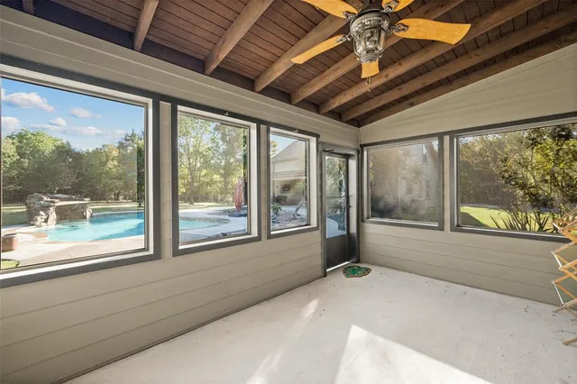 a view of room with window and ceiling fan