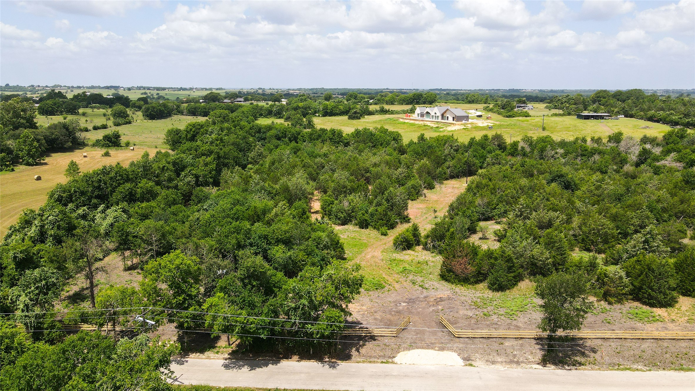Lot 8 Wonder Hill Road Chappell Hill, TX 77426 - Photo 11 of 15 a view of a lake with houses