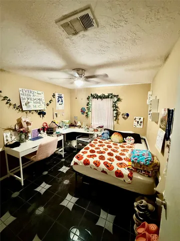 a bed room with furniture and a rug