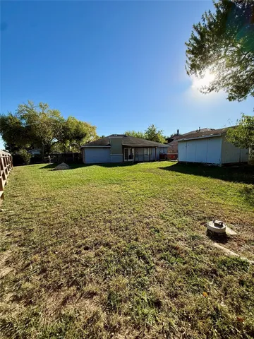 a view of a lake with houses in the background