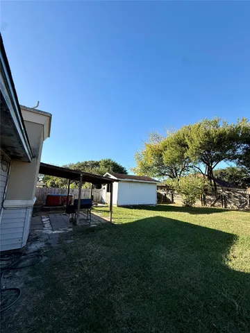 a view of a house with a yard porch and sitting area