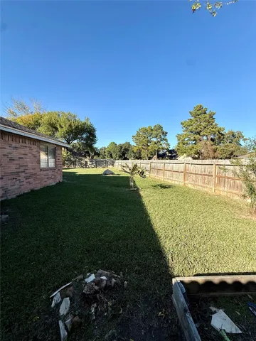 a view of a swimming pool with a yard