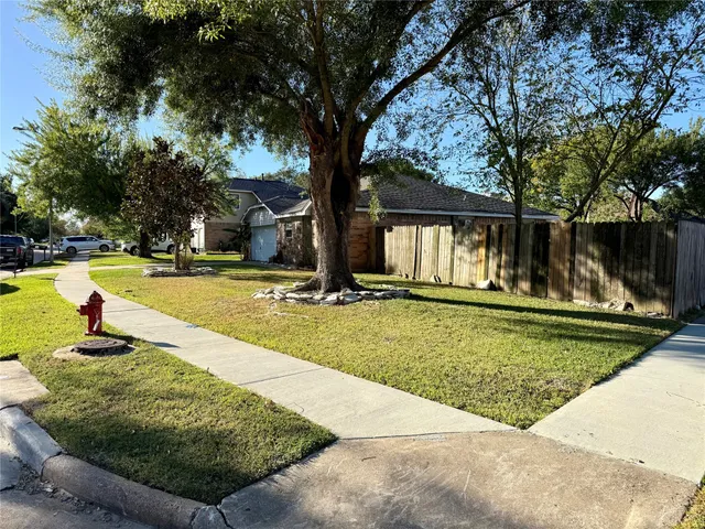 a swimming pool with outdoor seating and yard