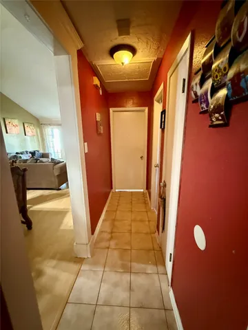 a view of a hallway with seating area