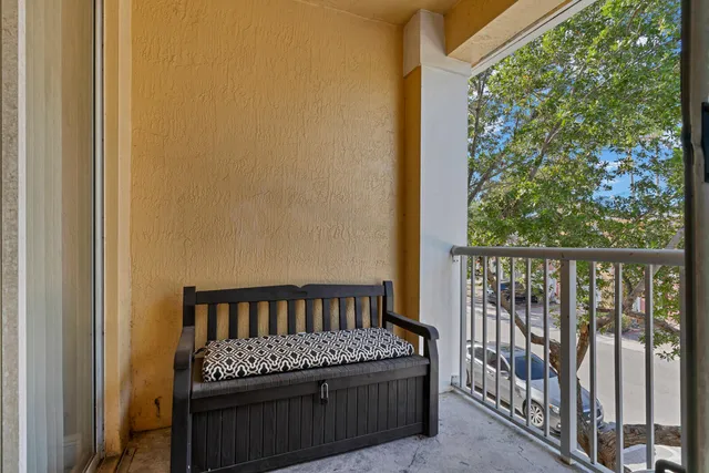 a view of a balcony with furniture