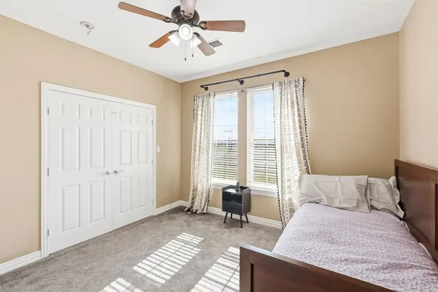 a bedroom with furniture and a window
