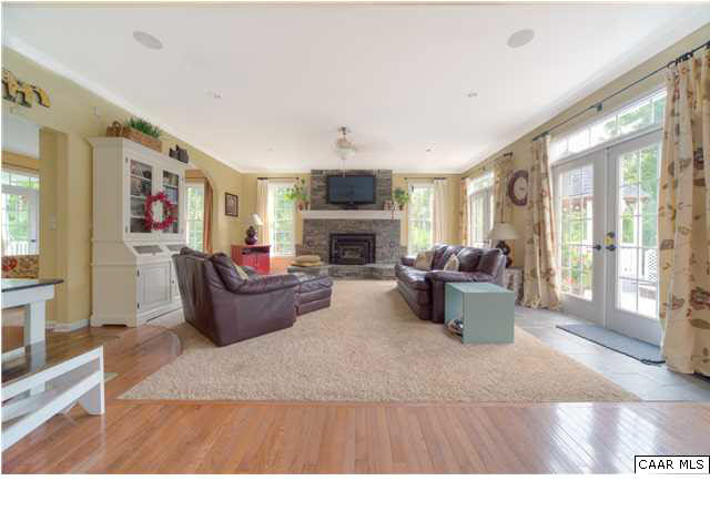 6725 Amicus Road Ruckersville, VA 22968 - Photo 13 of 50 a living room with furniture a fireplace and a flat screen tv