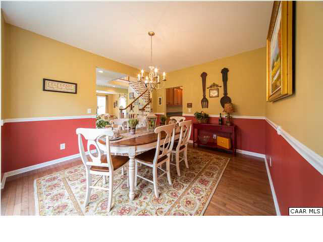 6725 Amicus Road Ruckersville, VA 22968 - Photo 15 of 50 a dining room with furniture a rug and a chandelier