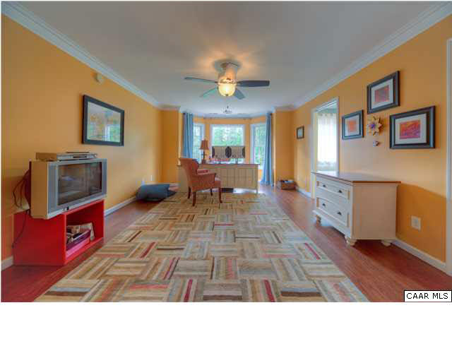 6725 Amicus Road Ruckersville, VA 22968 - Photo 23 of 50 a living room with furniture and a flat screen tv