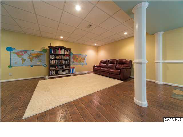 6725 Amicus Road Ruckersville, VA 22968 - Photo 38 of 50 a room with furniture and wooden floor
