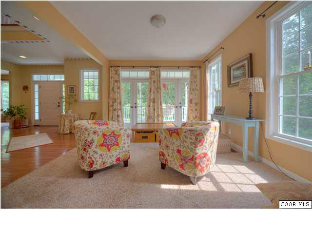 6725 Amicus Road Ruckersville, VA 22968 - Photo 7 of 50 a living room with furniture and large windows