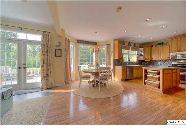 6725 Amicus Road Ruckersville, VA 22968 - Photo 10 of 50 a living room with stainless steel appliances granite countertop furniture wooden floor and a large window