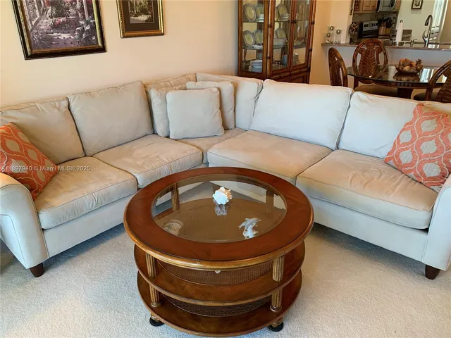 a living room with furniture and a couch