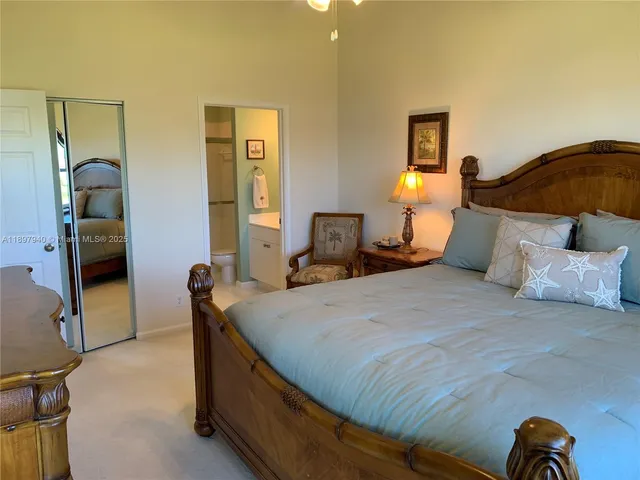 a bedroom with a bed and dresser