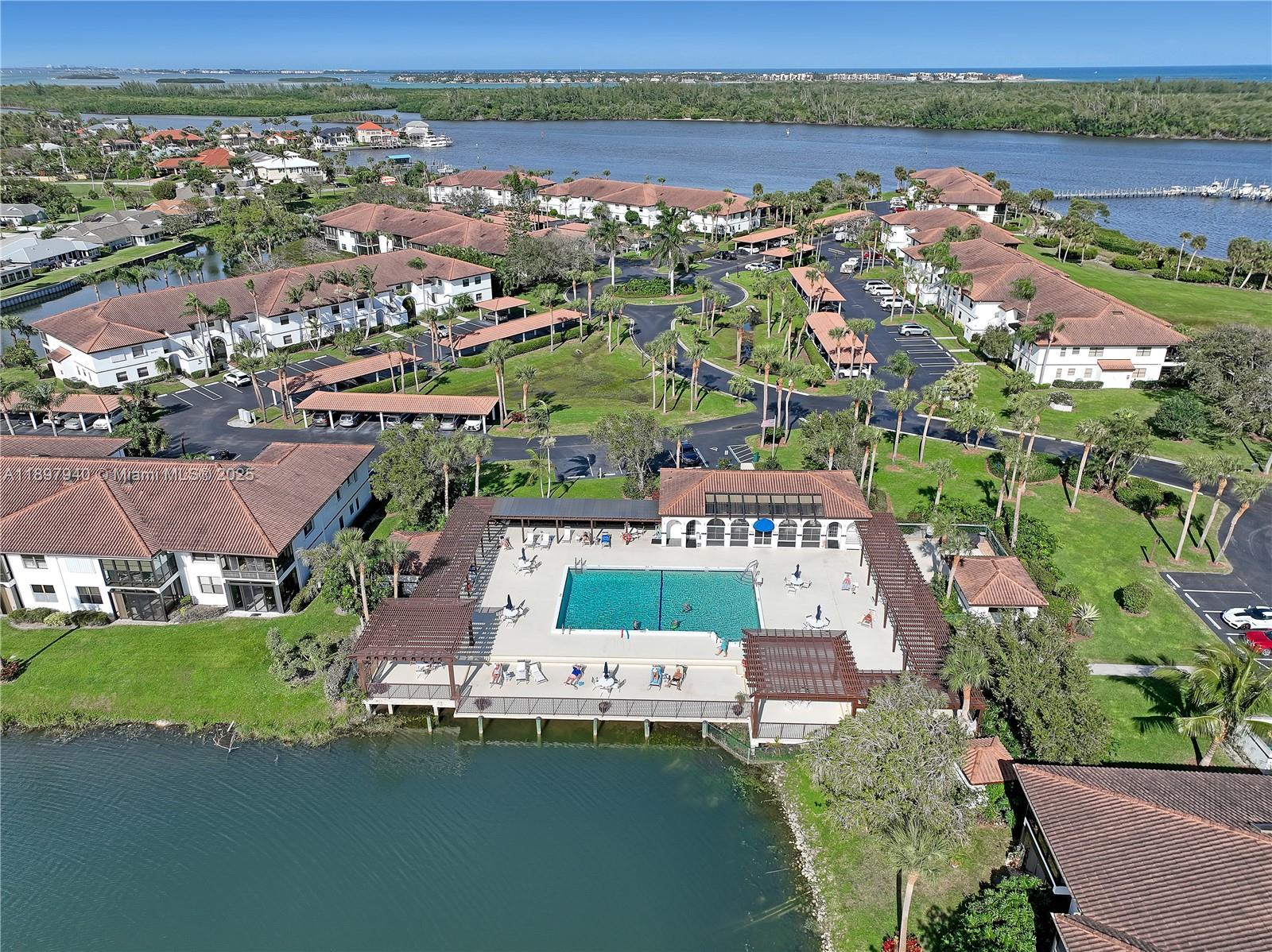 6062 Southeast Landing Way, Unit 15 Stuart, FL 34997 - Photo 40 of 43 an aerial view of a city with lots of residential buildings lake and ocean view