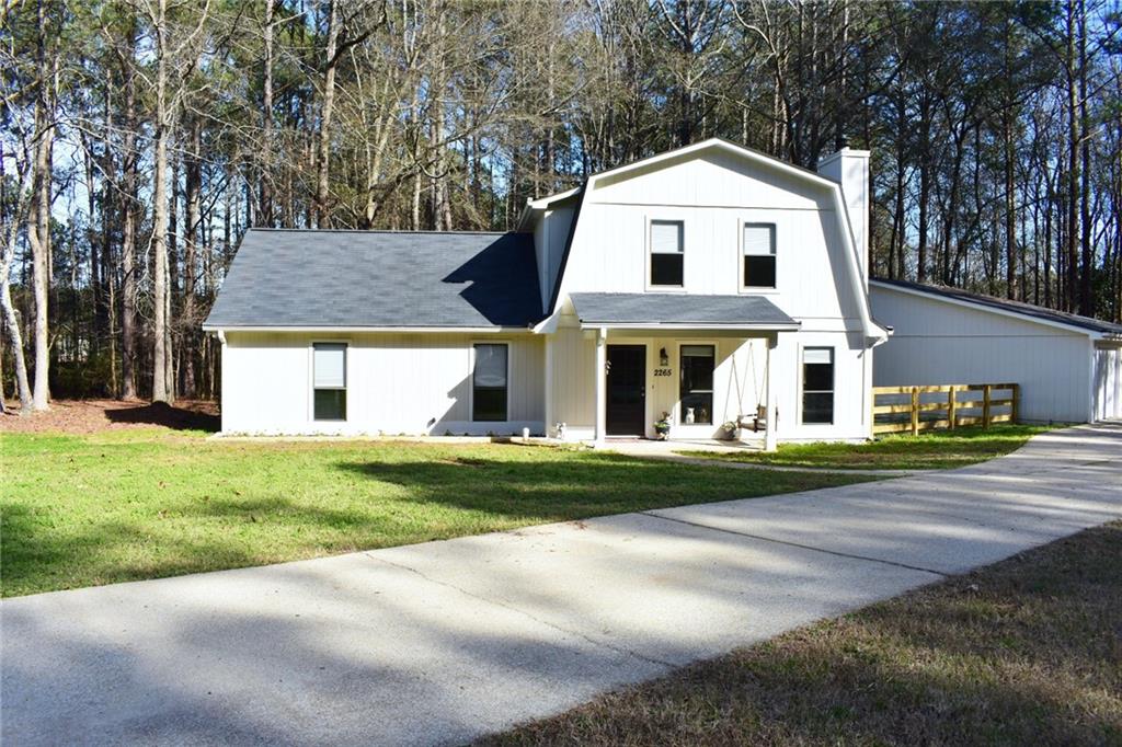 2265 Bullard Road Powder Springs, GA 30127 - Photo 1 of 1 a front view of a house with a yard