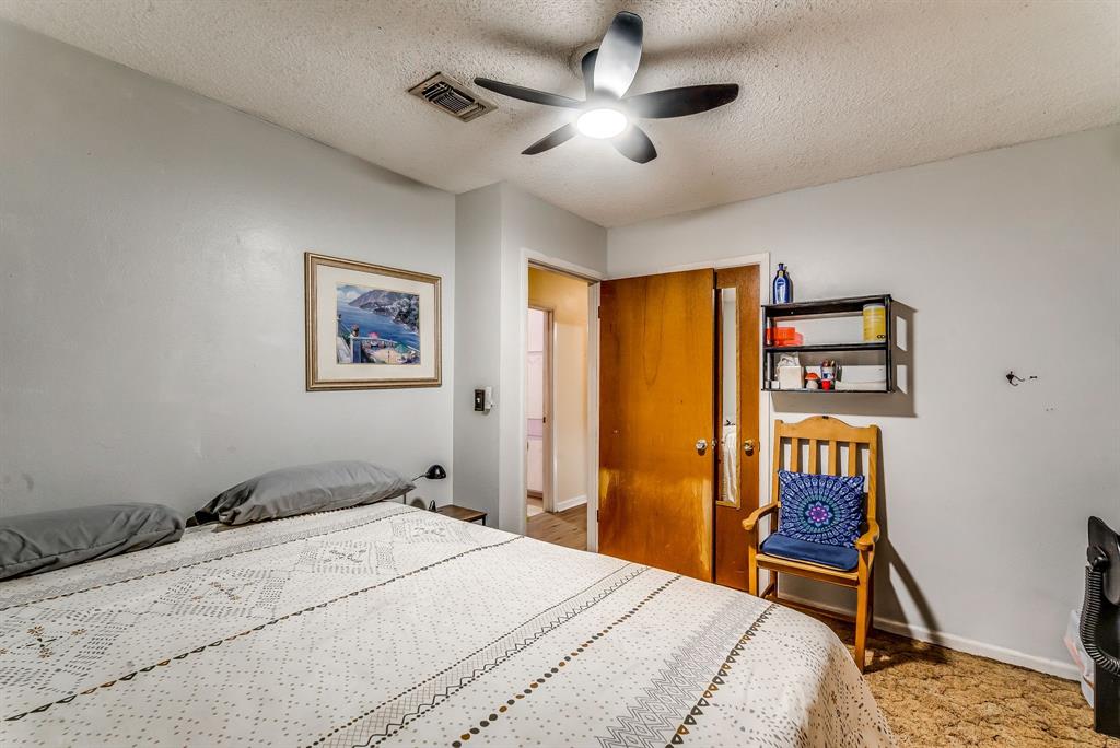 2912 Farm To Market 920 Weatherford, TX 76088 - Photo 20 of 28 Bedroom with baseboards, visible vents, ceiling fan, and a textured ceiling