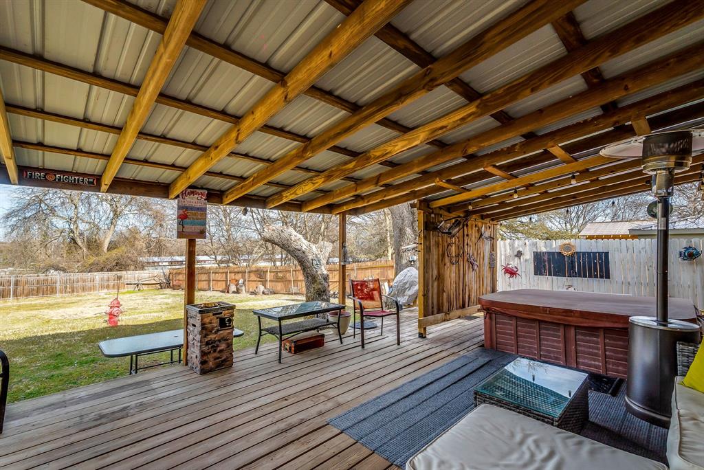 2912 Farm To Market 920 Weatherford, TX 76088 - Photo 22 of 28 Wooden deck with a hot tub and a fenced backyard