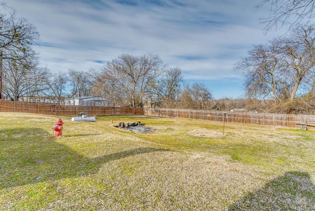 2912 Farm To Market 920 Weatherford, TX 76088 - Photo 27 of 28 View of yard featuring a fenced backyard