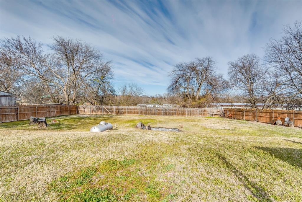 2912 Farm To Market 920 Weatherford, TX 76088 - Photo 28 of 28 View of yard with a fenced backyard