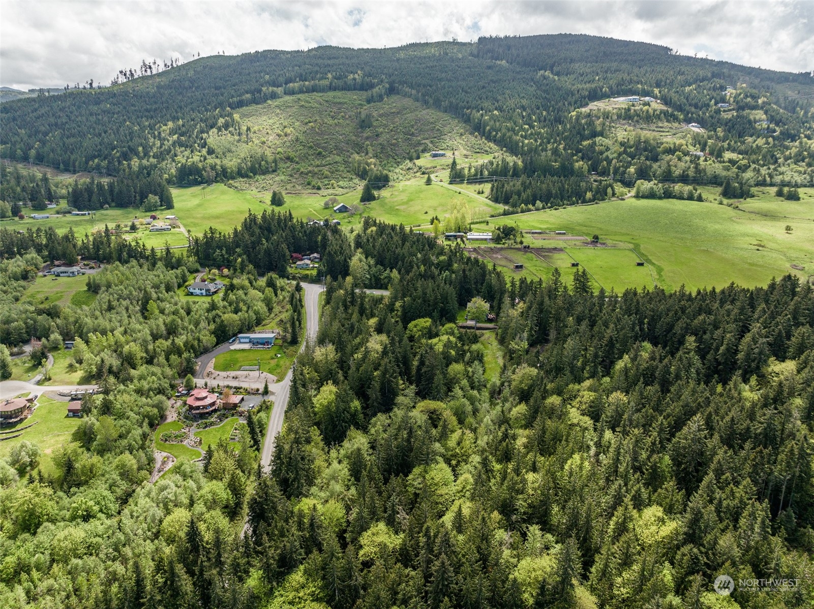 999 Louella Road Sequim, WA 98382 - Photo 11 of 38 an aerial view of residential houses with outdoor space and trees