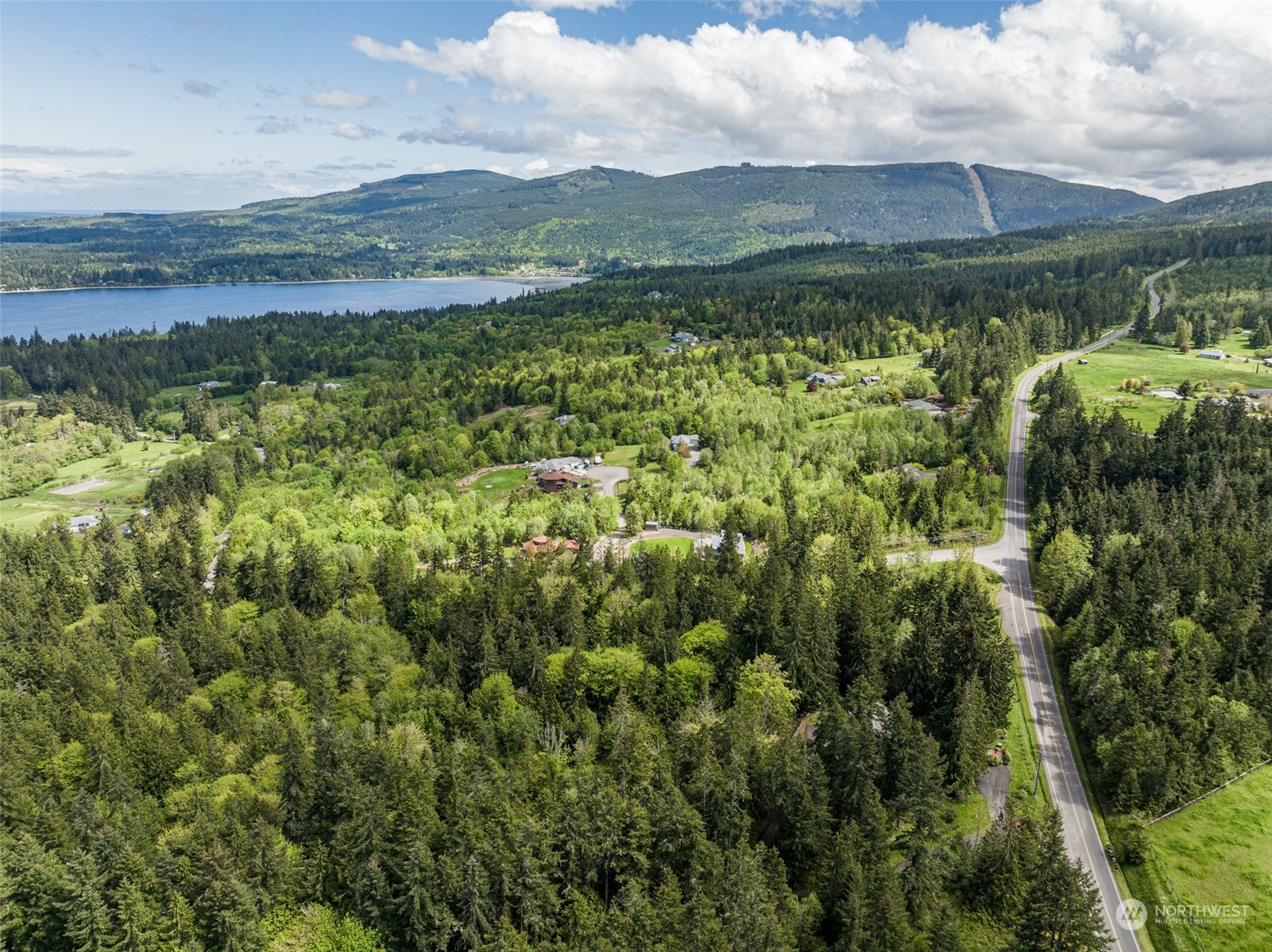 999 Louella Road Sequim, WA 98382 - Photo 13 of 38 a view of a lake with a mountain in the background